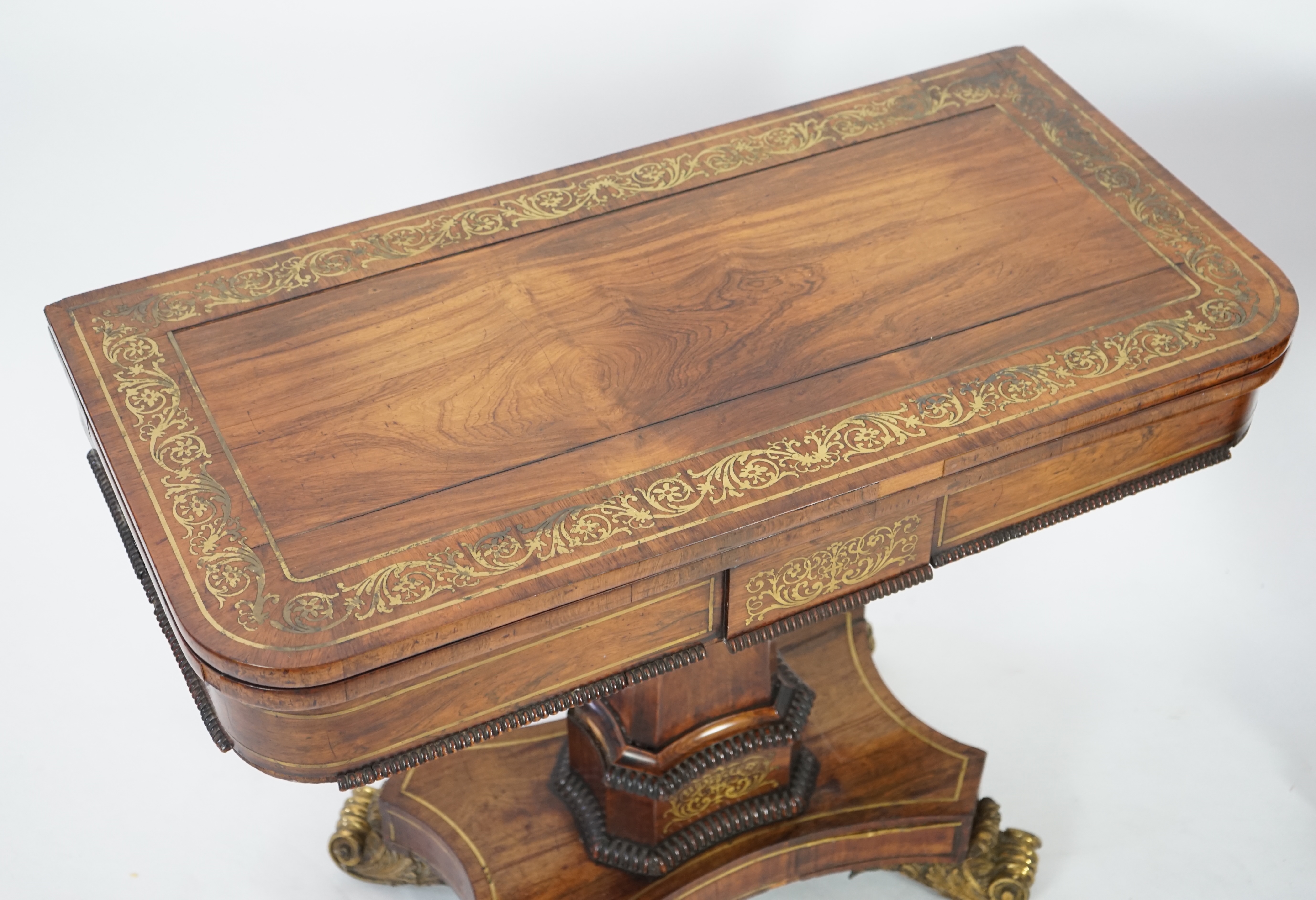 A pair of Regency brass inset rosewood card tables